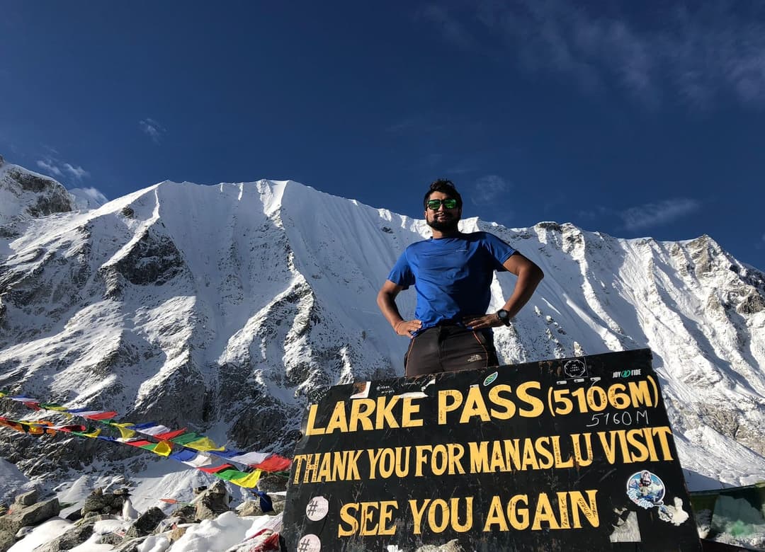 Trekker clicking photos at Larke Pass